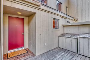 a red door on the side of a house at Lodge Condo 021 in Black Butte Ranch