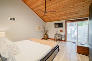 a bedroom with a bed and a wooden ceiling at Lodge Room 006 in Black Butte Ranch