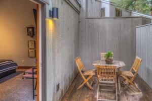 a table and chairs on a patio with a plant at Lodge Room 006 in Black Butte Ranch