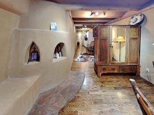 a living room with a sink and a mirror at Casita Mariposa in Santa Fe +9 photos