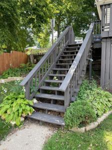 a set of stairs leading up to a house at Wide River Winery Inn in Le Claire