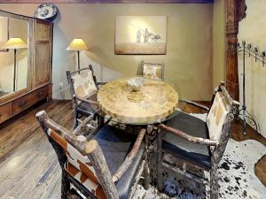 a dining room with a table and chairs at Casita Mariposa in Santa Fe