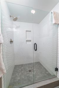 a shower with a glass door in a bathroom at Lodge Room 019 in Black Butte Ranch