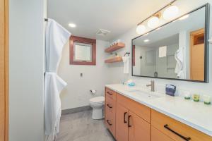 a bathroom with a sink and a mirror at Lodge Room 019 in Black Butte Ranch