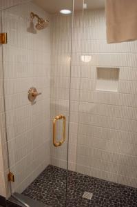 a shower with a glass door in a bathroom at Lodge Room 016 in Black Butte Ranch +4 photos