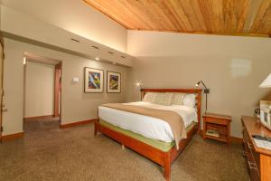 a bedroom with a bed and a wooden ceiling at Lodge Room 024 in Black Butte Ranch