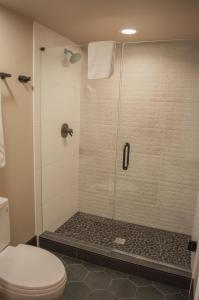a bathroom with a shower with a toilet at Lodge Room 015 in Black Butte Ranch
