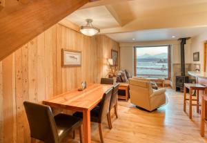 a dining room with a wooden table and chairs at Country House 065 in Black Butte Ranch