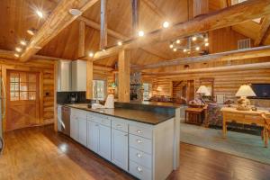 an open kitchen with wooden walls and wooden floors at Golf Home 105 in Black Butte Ranch +7 photos