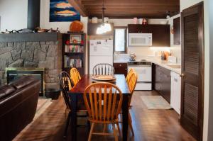 a kitchen and dining room with a table and chairs at Ridge Cabin 022 in Black Butte Ranch