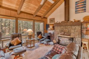 a living room filled with furniture and a fireplace at Ridge Cabin 022 in Black Butte Ranch