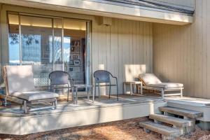 a group of chairs and tables on a porch at Lodge Room 023 in Black Butte Ranch