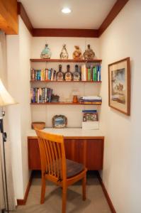 a room with a desk with a chair and books at Golf Condo 098 in Black Butte Ranch