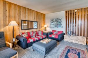 a living room with two couches and a table at Country House 073 in Black Butte Ranch