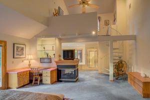 a bedroom with a living room with a fireplace at East Meadow 017 in Black Butte Ranch +23 photos