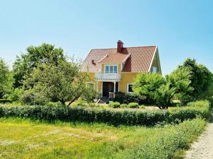 a yellow house with a red roof at 8 person holiday home in Moheda-By Traum in Moheda
