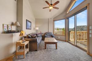 a living room with a couch and a table at Teepee Mountain 12A Condo in Estes Park