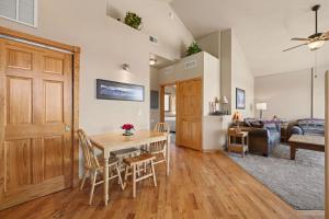a kitchen and living room with a table and chairs at Teepee Mountain 12A Condo in Estes Park +34 photos