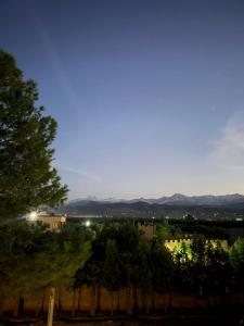 a view of a city with mountains in the distance at Atlas Serenity Villa Marrakech in Sbiti