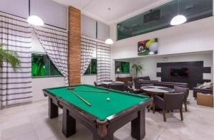 a living room with a pool table in it at Bombinhas summer bech in Bombinhas