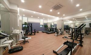 a gym with a bunch of treadmills and machines at 아셈호텔 in Taech'on +2 photos