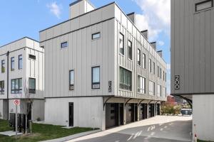a large white building on the side of a street at SkyBox|Rooftop|Downtown in Traverse City