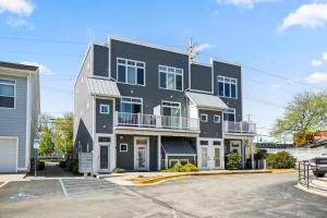 a large black building with a parking lot at Midcentury Getaway: Walk to Everything! in Traverse City