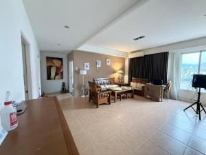 a living room with a couch and a table at G.S. Holiday Home in Guanshan