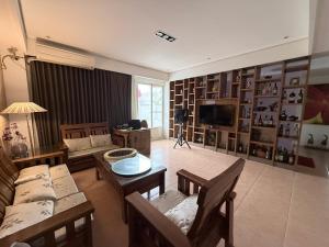 a living room with a couch and a table at G.S. Holiday Home in Guanshan