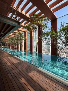 a swimming pool on the roof of a building at The Reforma 27 Grand in Mexico City