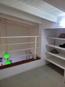 a room with white shelves and lights on the wall at Departamento morderno y centrico-Paseo Plaza in Navarro