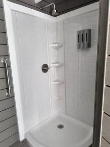a bathroom with a shower with a toilet and a sink at Zaromelranch deck in Agua Dulce