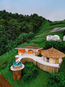 an aerial view of a house on a hill at ดอกฟ้า ม่อนแจ่ม in Mon Jam
