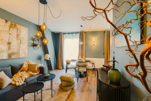 a living room with a couch and a table at Maison Kolsaas in Vernon
