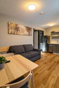 a living room with a couch and a table at Kokanee Glacier Resort in Nelson