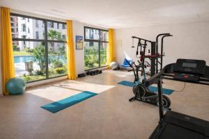 a fitness room with a gym with a treadmill at Affordable Luxury Apartment in Nouaseur