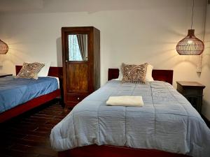 a bedroom with a large bed and a window at Mận Đào Villa in Ho Chi Minh City
