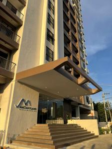 a building with stairs in front of a building at Mactan Plains Residences in Mactan