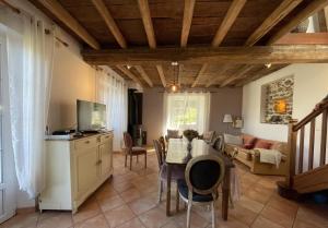 a living room with a table and a couch at Peyre in Aramits