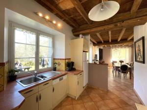 a kitchen with a sink and a counter top at Peyre in Aramits