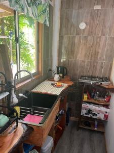 a kitchen with a sink and a counter top at Cabaña Rei miro in Hanga Roa