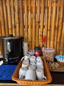 a tray filled with cups and food on a table at Primmy house kohtao in Ko Tao