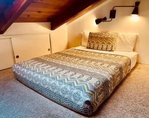 a bedroom with a bed in a room at Riverfront with EV charger - Sequoia River Cottage in Three Rivers