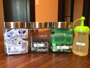 a group of three jars sitting on a table at MEIBI Hakone Yumoto in Hakone
