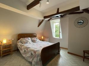a bedroom with a bed and a window at Chez file in Séméacq-Blachon +23 photos