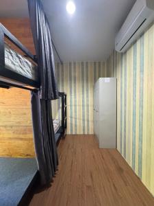 a room with a bunk bed and a hallway at Primmy house kohtao in Ko Tao