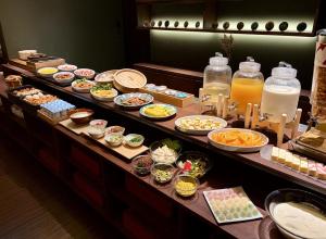 a buffet line with many different types of food at HOTEL AMANEK Kanazawa in Kanazawa