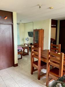 a room with chairs and a table and a mirror at PG Vacation Rental in Lapu Lapu City