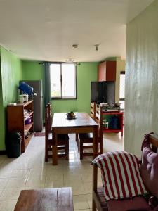 a kitchen and dining room with a table and chairs at PG Vacation Rental in Lapu Lapu City +19 photos