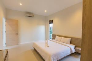 En eller flere senge i et værelse på Luxury House in Hua Hin